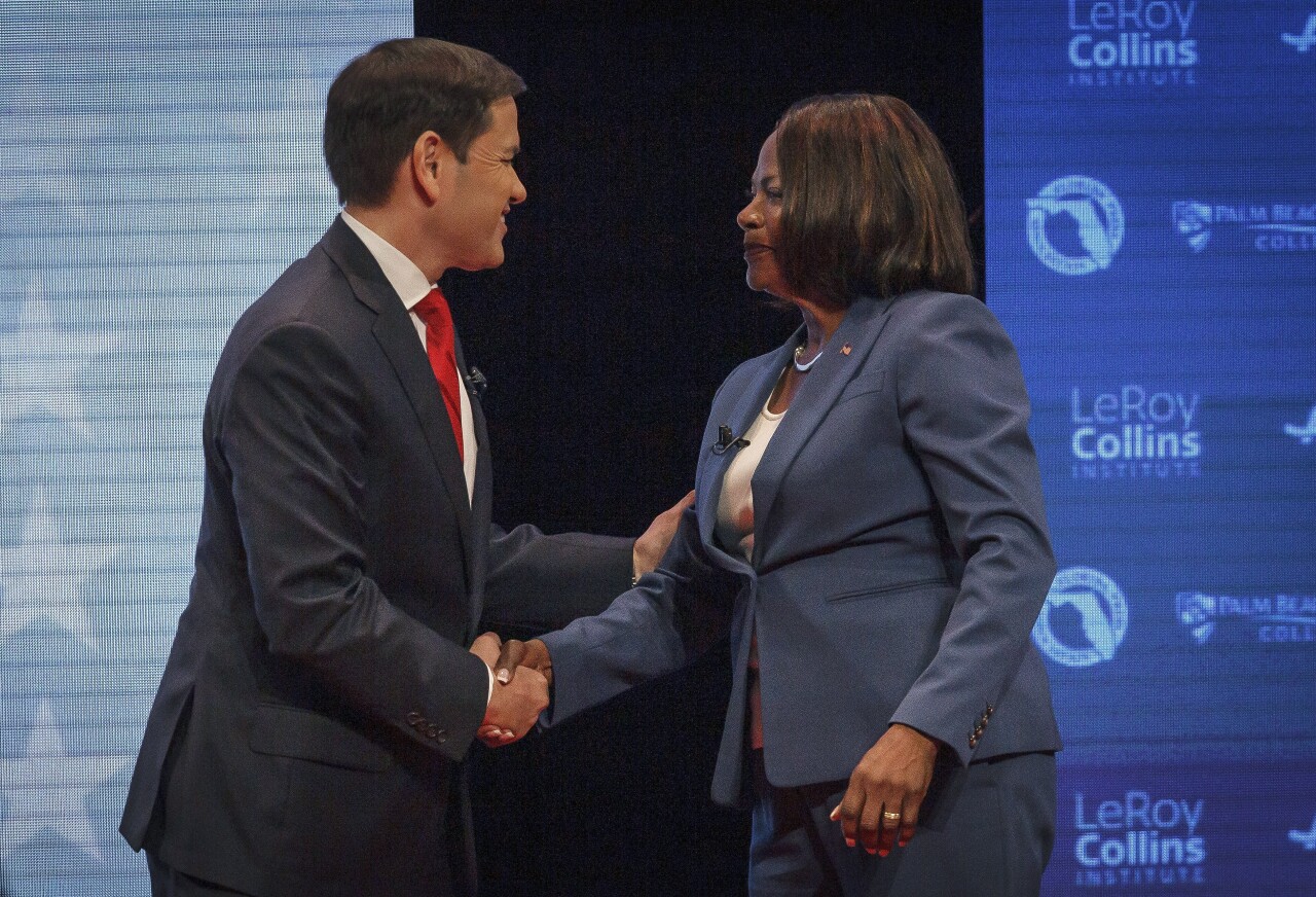 Marco Rubio and Val Demings shake hands before Florida Senate debate, Oct. 18, 2022