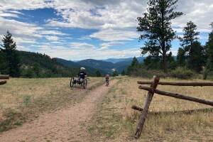 Tyler Wilson biking with son
