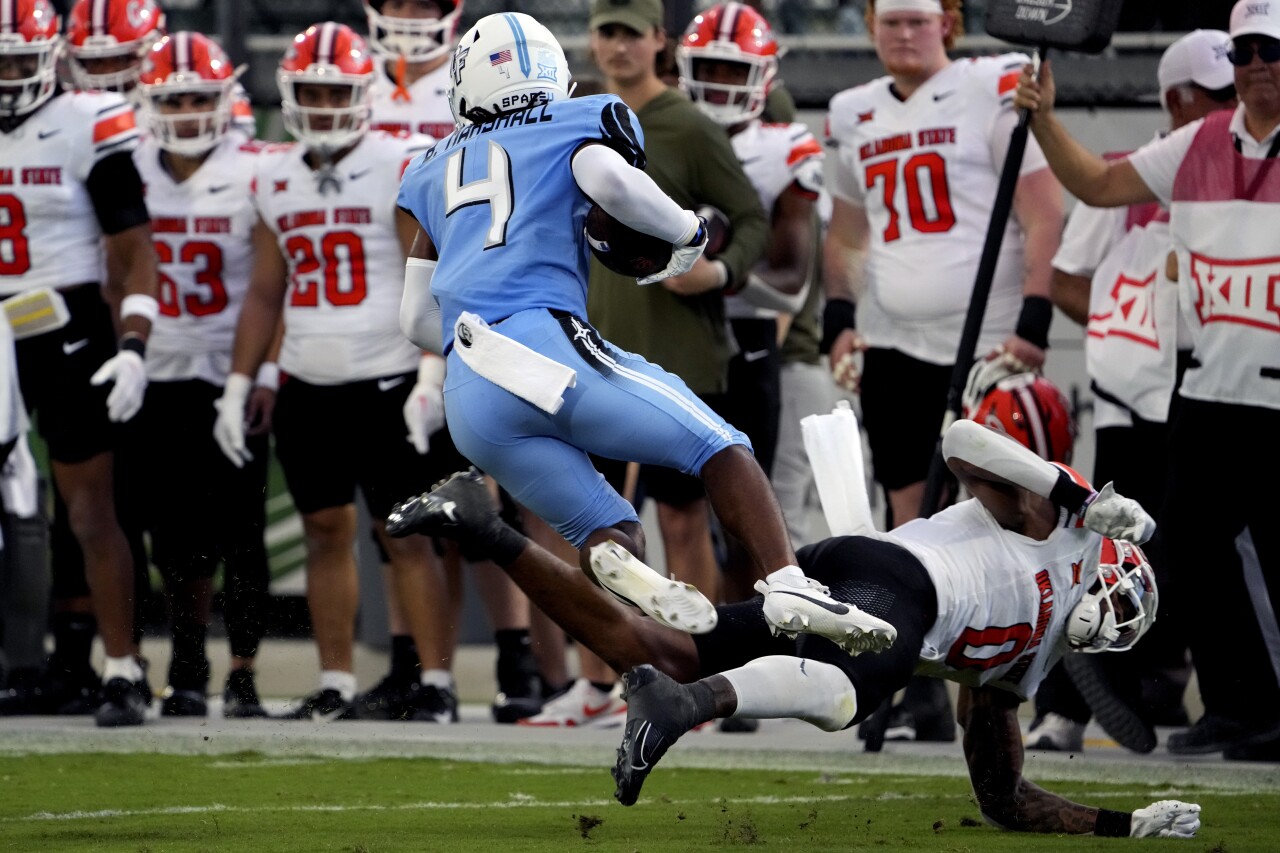 UCF Knights cornerback Braeden Marshall returns interception before being tripped up by Oklahoma State Cowboys running back Ollie Gordon, Nov. 11, 2023