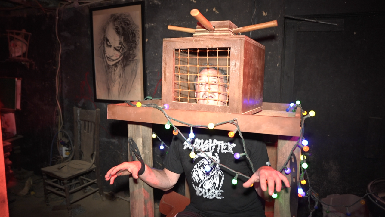 Ken Evans showing off some props at Slaughterhouse Adventure