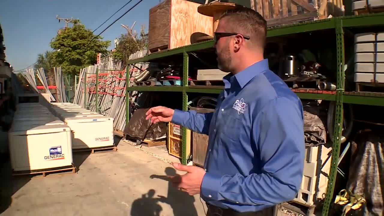 Jesse Rack, owner of Rack Electric, shows off generators going to former Energized Electric customers
