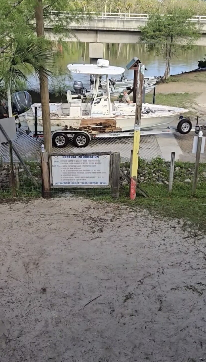Crews pull damaged boat from the water near the Wakulla River Lower Bridge Boat Ramp