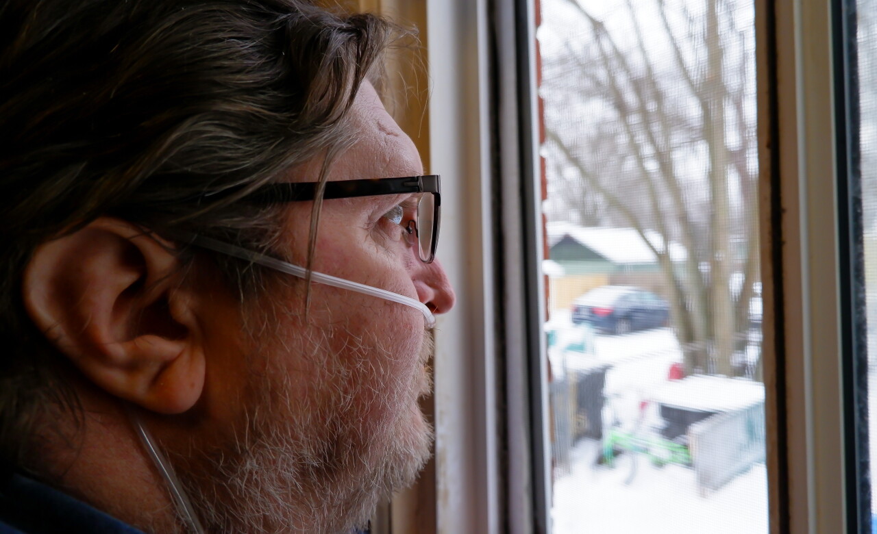 William Hershey watches Virginia LaForce_s bonfire from inside their home. (Noor Hindi_The Devil Strip).jpeg