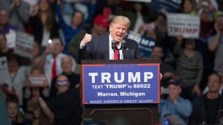 Republican presidential candidate Donald Trump speaks to guests during a rally at Macomb Community College on March 4, 2016.