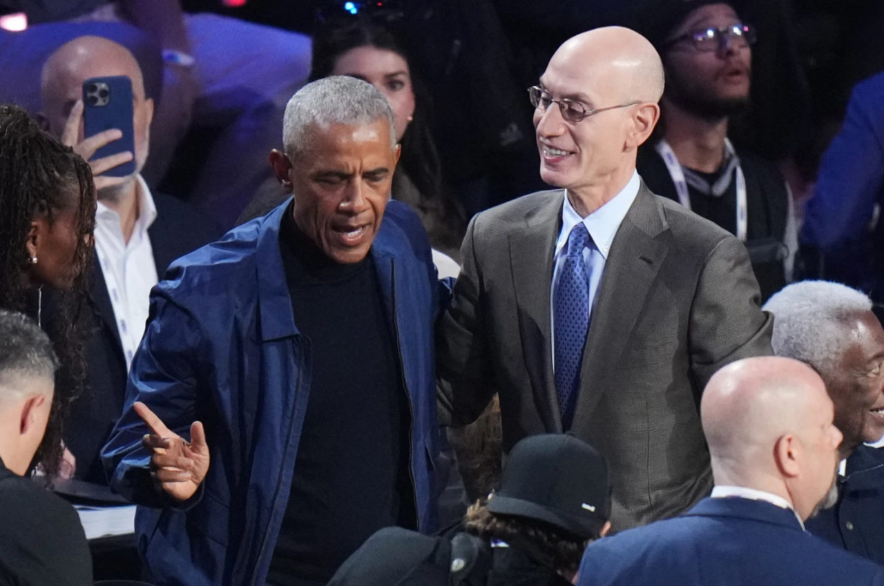 Barack Obama talks to commissioner Adam Silver before the NBA All-Star basketball game Sunday, Feb. 15, 2026, in Inglewood, Calif.
