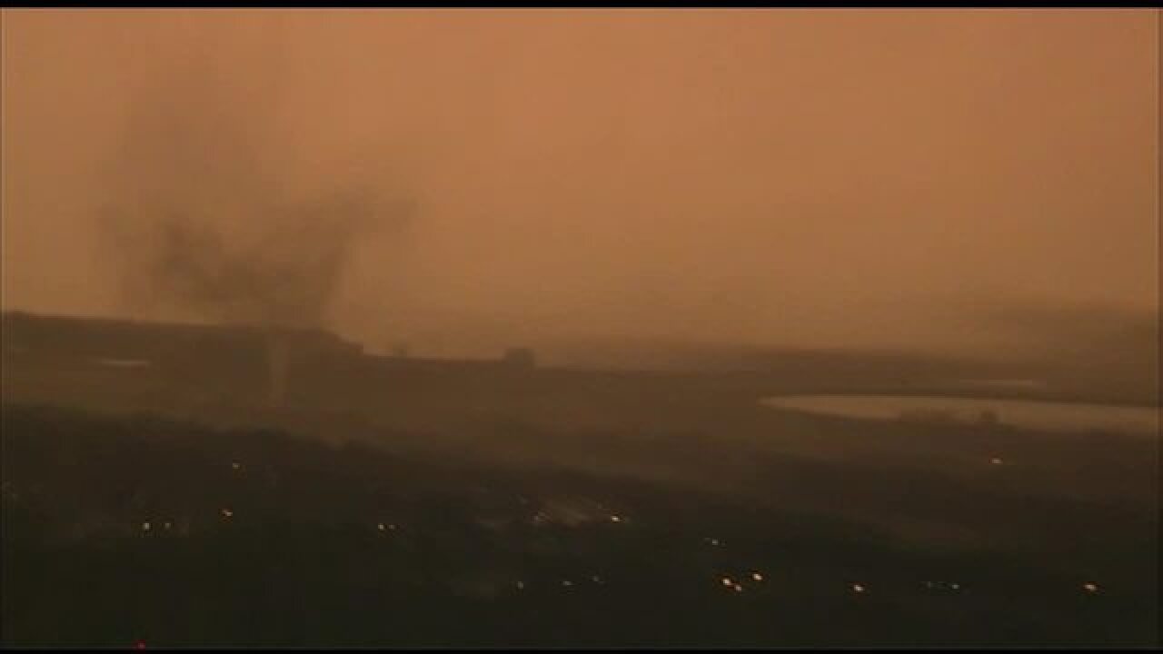 PHOTOS: Tornado forms, touches down