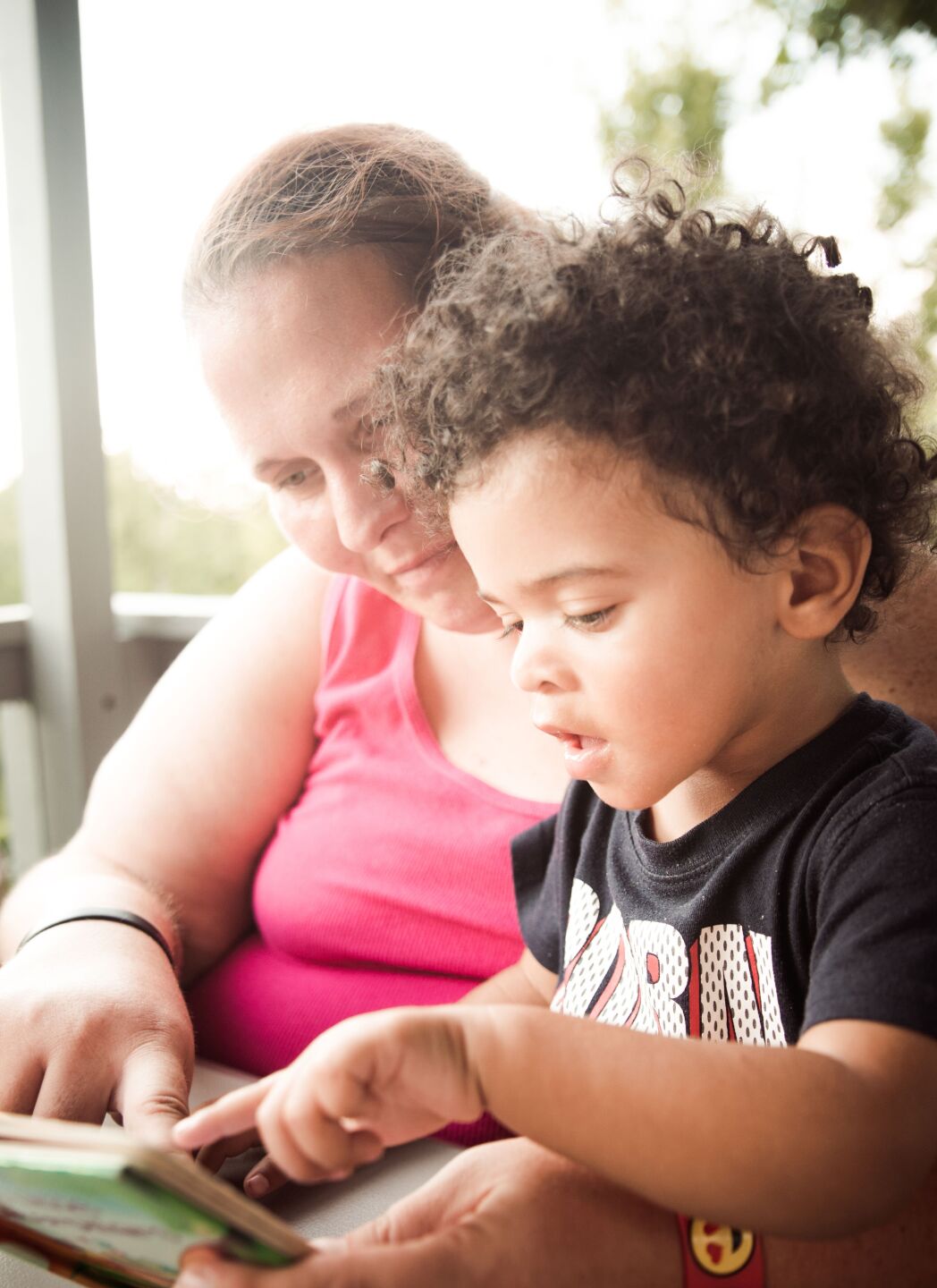 A mother reads with her son