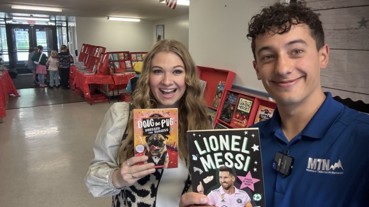 MTN's Madelyn Heath (left) and Jonny Walker (right) at Broadwater Elementary's book fair