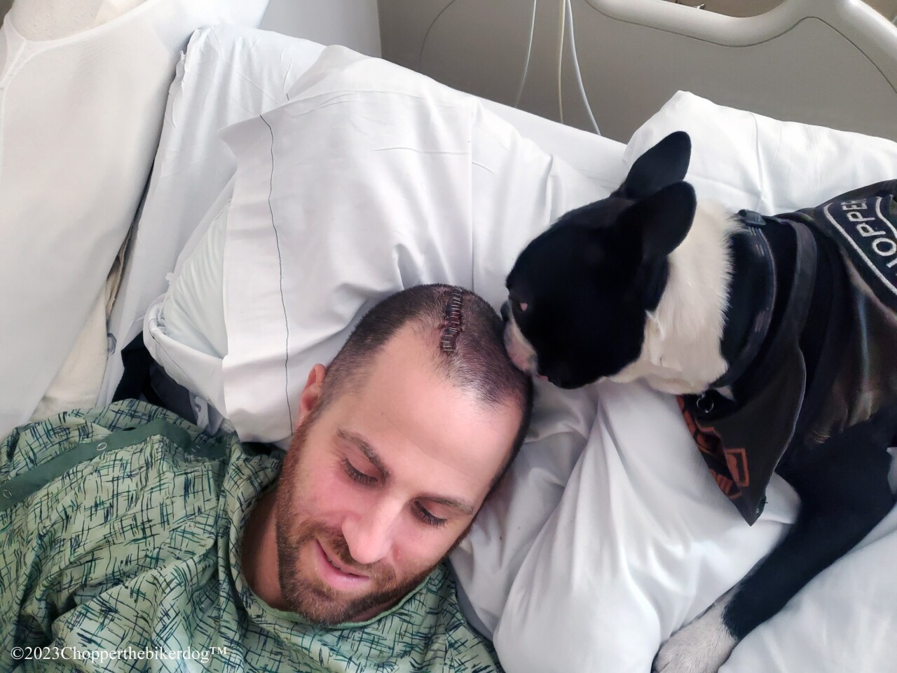 Chopper the Biker Dog visits Sgt. Anthony Elliott in hospital