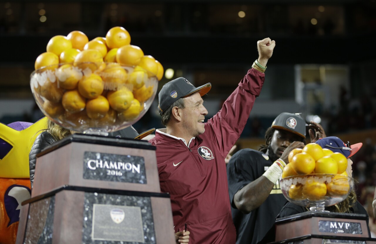 Florida State Seminoles head coach Jimbo Fisher holds fist in air after winning 2016 Orange Bowl