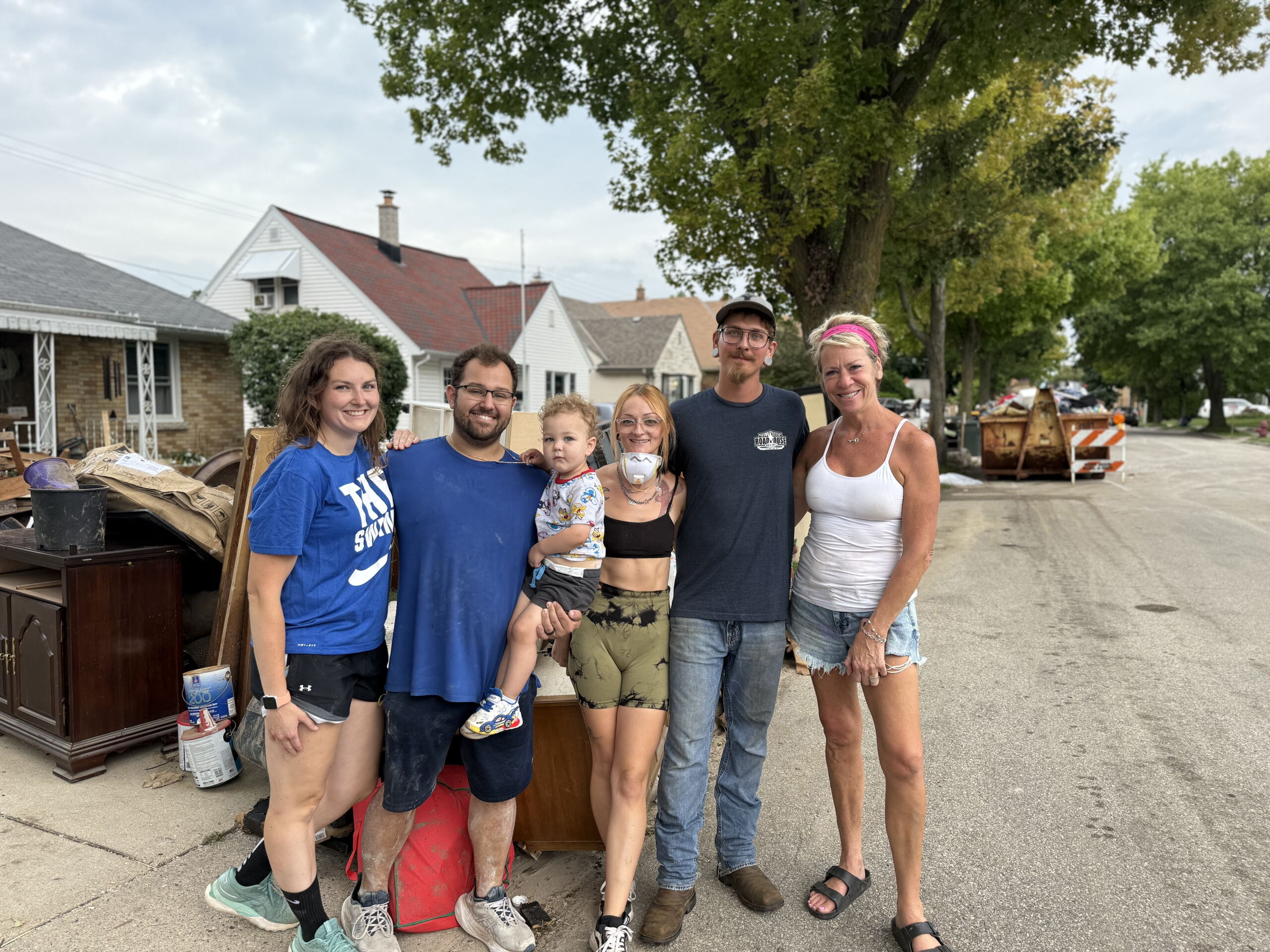 West Allis neighbors help each other cleanup as more storms move in