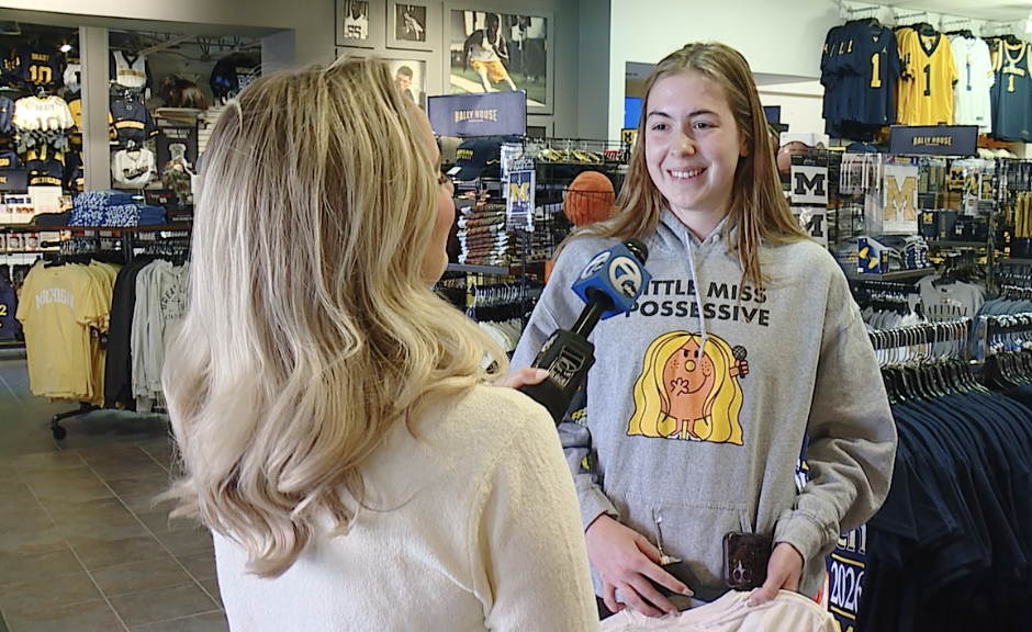 University of Michigan student Fiona Hawk picking up some gear