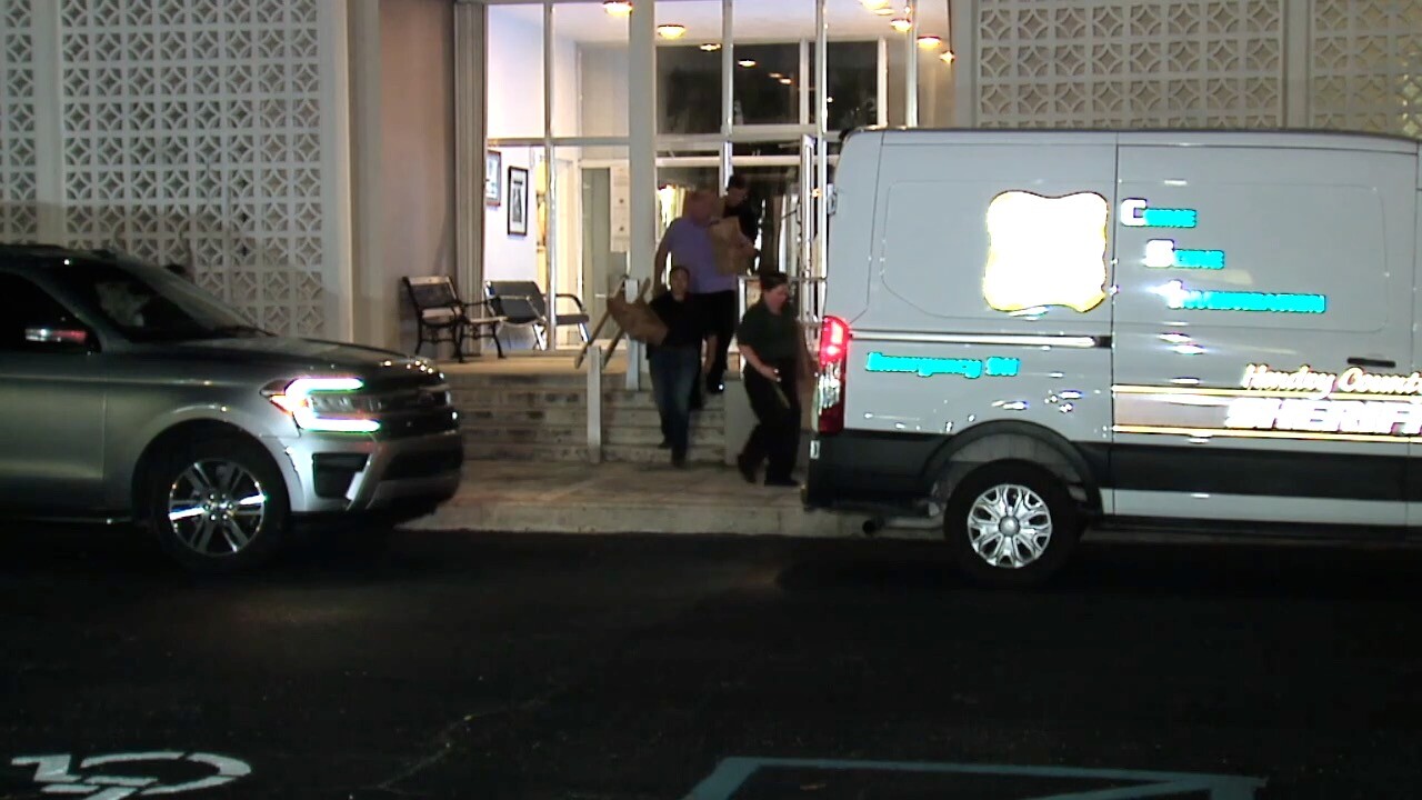 Investigators leaving Clewiston City Hall with evidence in October