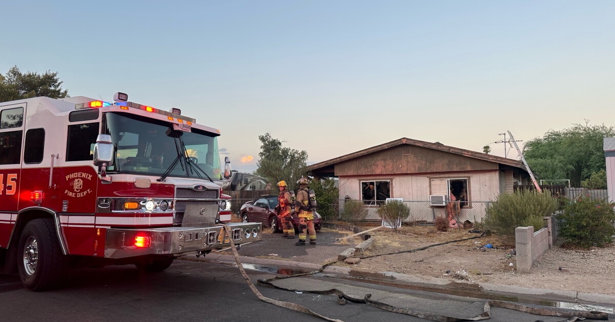 Woman taken to hospital after being rescued from burning home