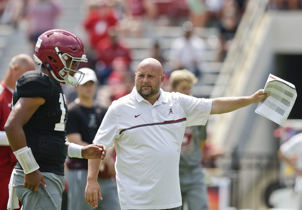 Alabama Crimson Tide offensive coordinator Brian Daboll talks to QB Tua Tagovailoa in August 2017