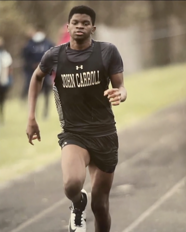 A photo of Bailey Bullock running track