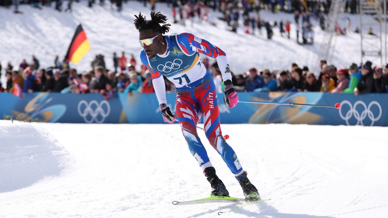 Haiti's first Olympic cross-country skier celebrated by crowd after jubilant finish in men's skiathlon