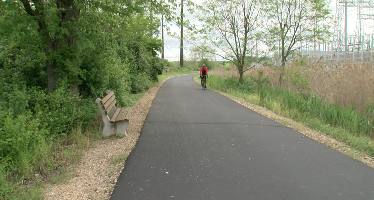 A cyclist rides past the Tanners Creek site