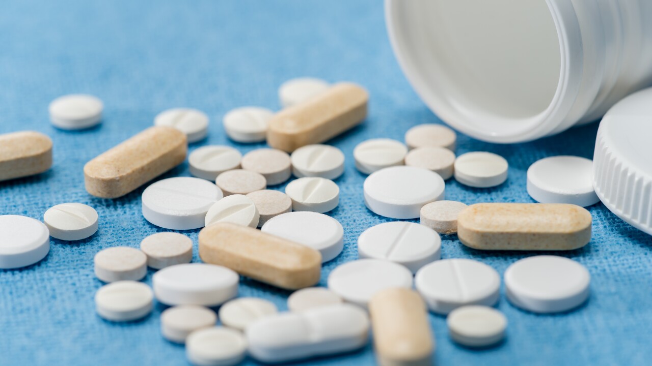 Medicament pills on medical blue background