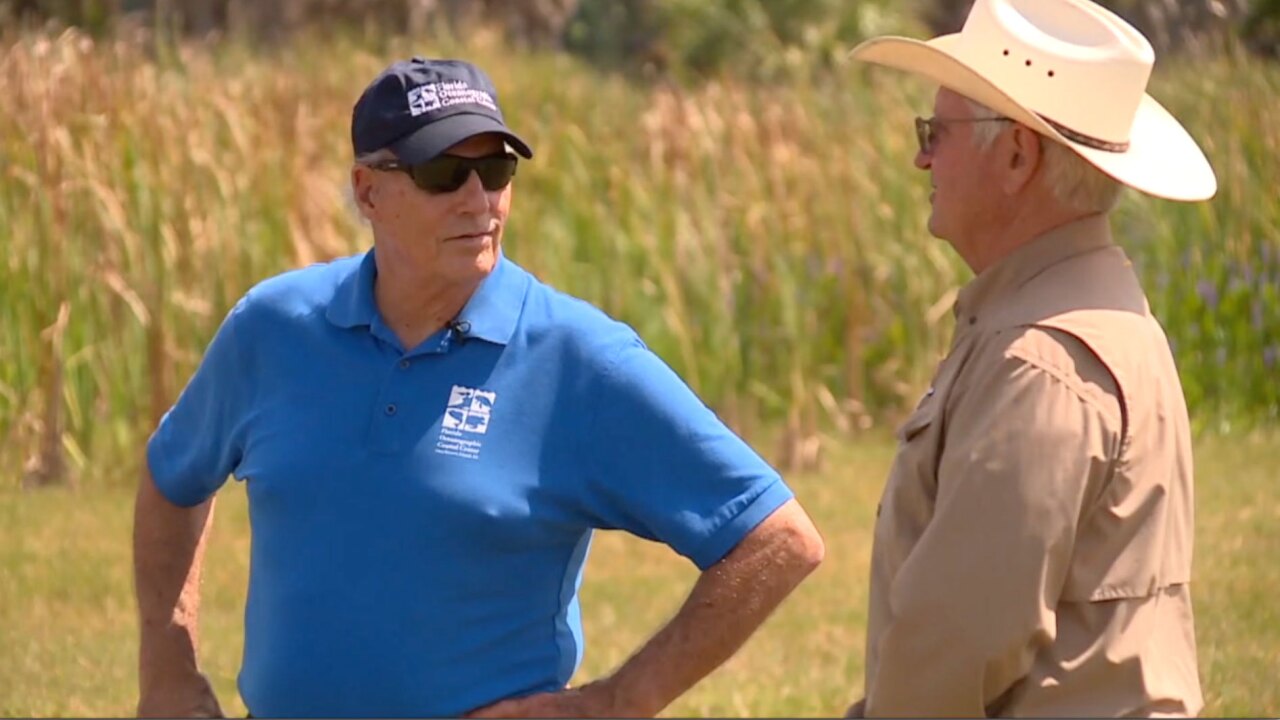 Mark Perry (left) and Wes Williamson discuss the efforts being made to reduce phosphorus runoff into Lake Okeechobee.