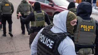 FILE - Federal agents conduct immigration enforcement operations Thursday, Feb. 5, 2026, in Minneapolis.