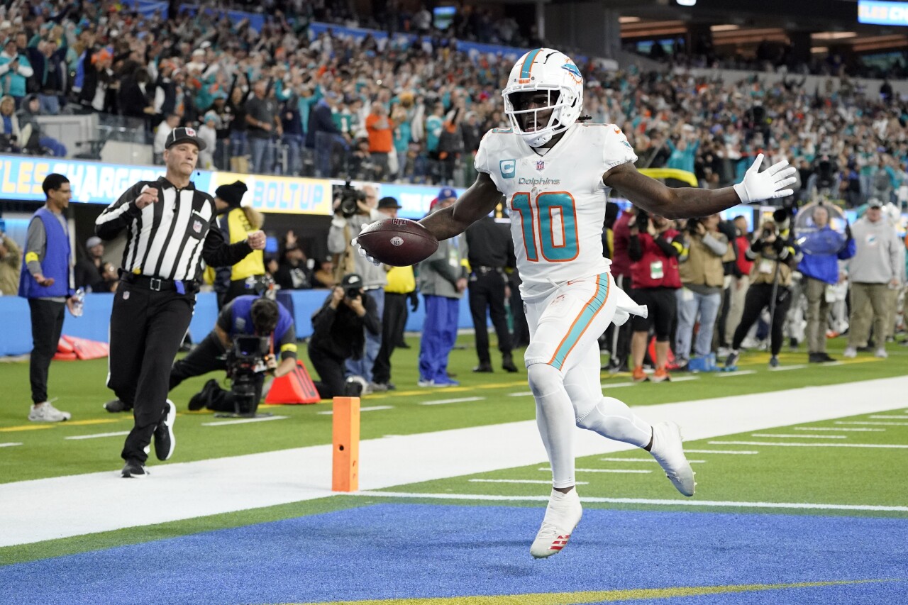 Miami Dolphins receiver Tyreek Hill scores 57-yard fumble recovery for TD at Los Angeles Chargers, Dec. 11, 2022