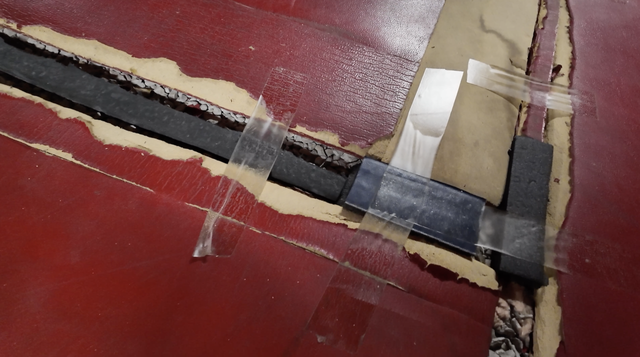 duct tape on mats in basement.png