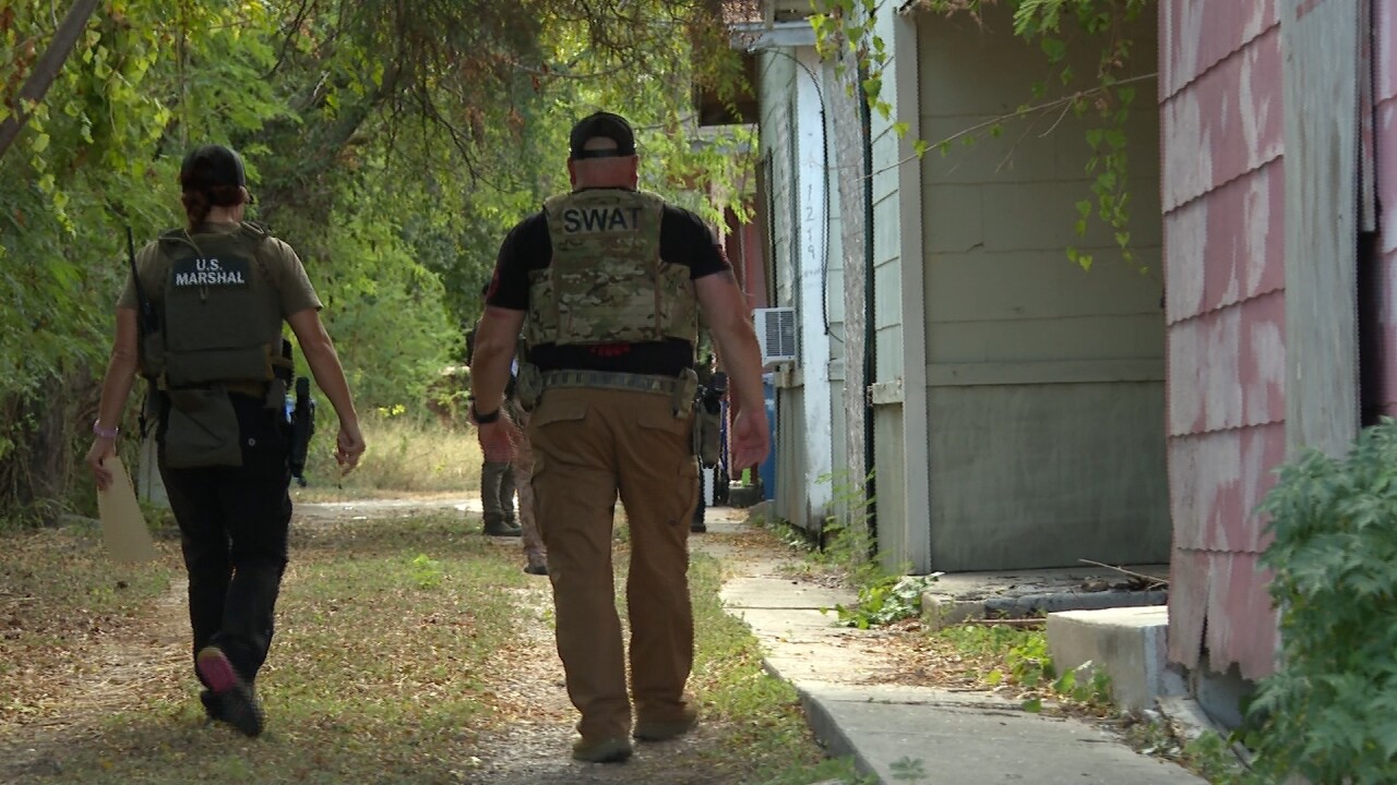 Law enforcement make checks on registered sex offenders.