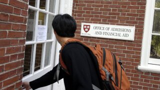 A student enters the admissions office at Harvard University in September 2006