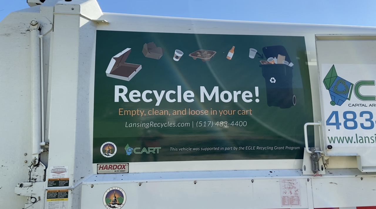 Recycle sign on the side of a CART truck