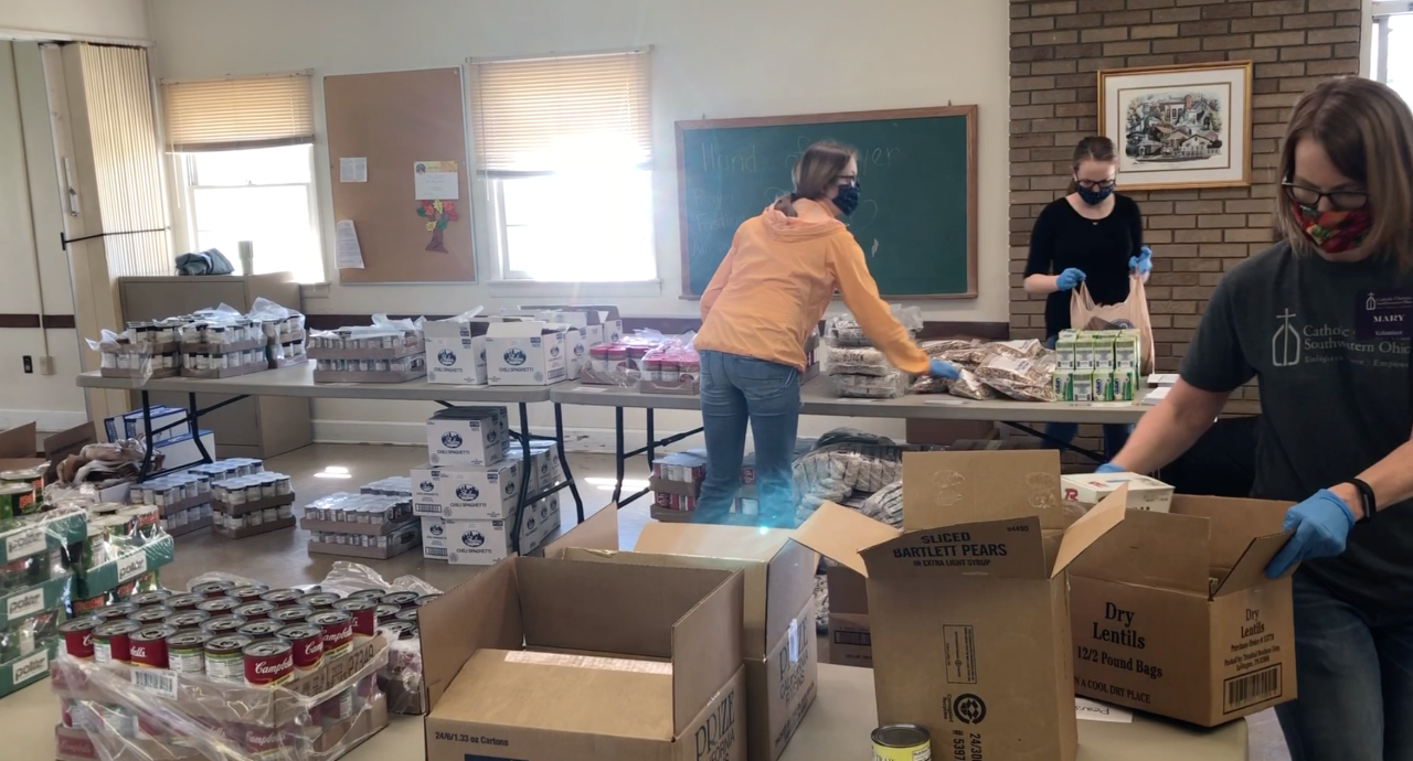 Volunteers getting ready for the Food For All drive-through, wearing masks and gloves