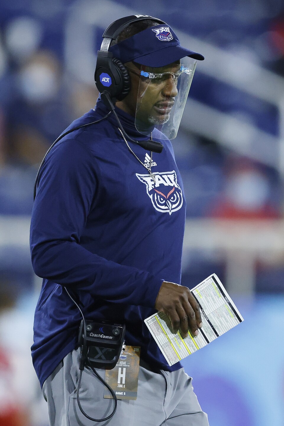 FAU Owls head coach Willie Taggart on sideline with face shield in 2020