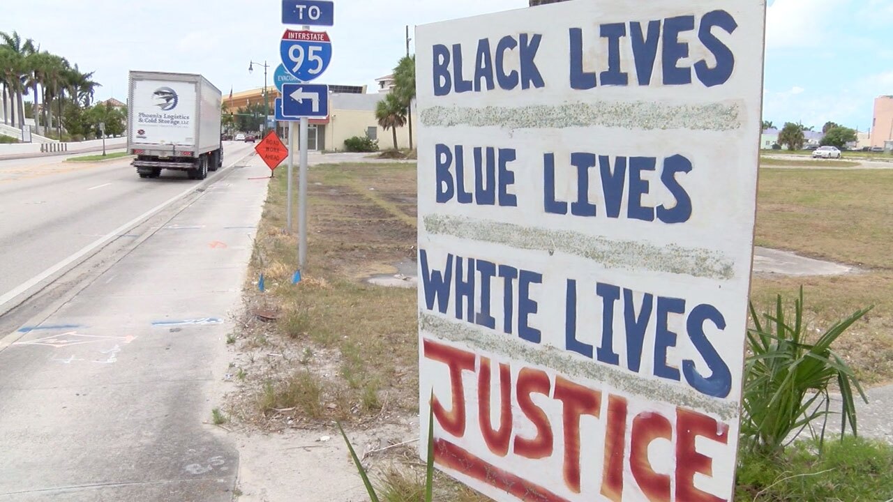 Sign in Fort Pierce reads "Black lives, Blue lives, White lives, Justice" one year after George Floyd's death