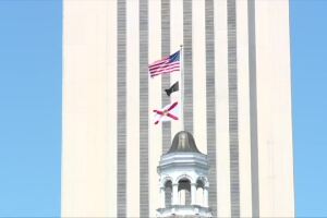 U.S. flag and Florida flag fly outside Capitol building in Tallahassee