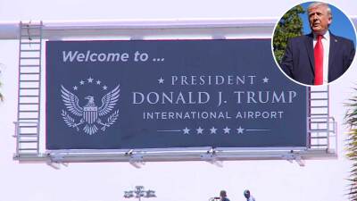 At the airport entrance on July 8, 2026, workers installed a new sign that says "Welcome to President Donald J. Trump International Airport."