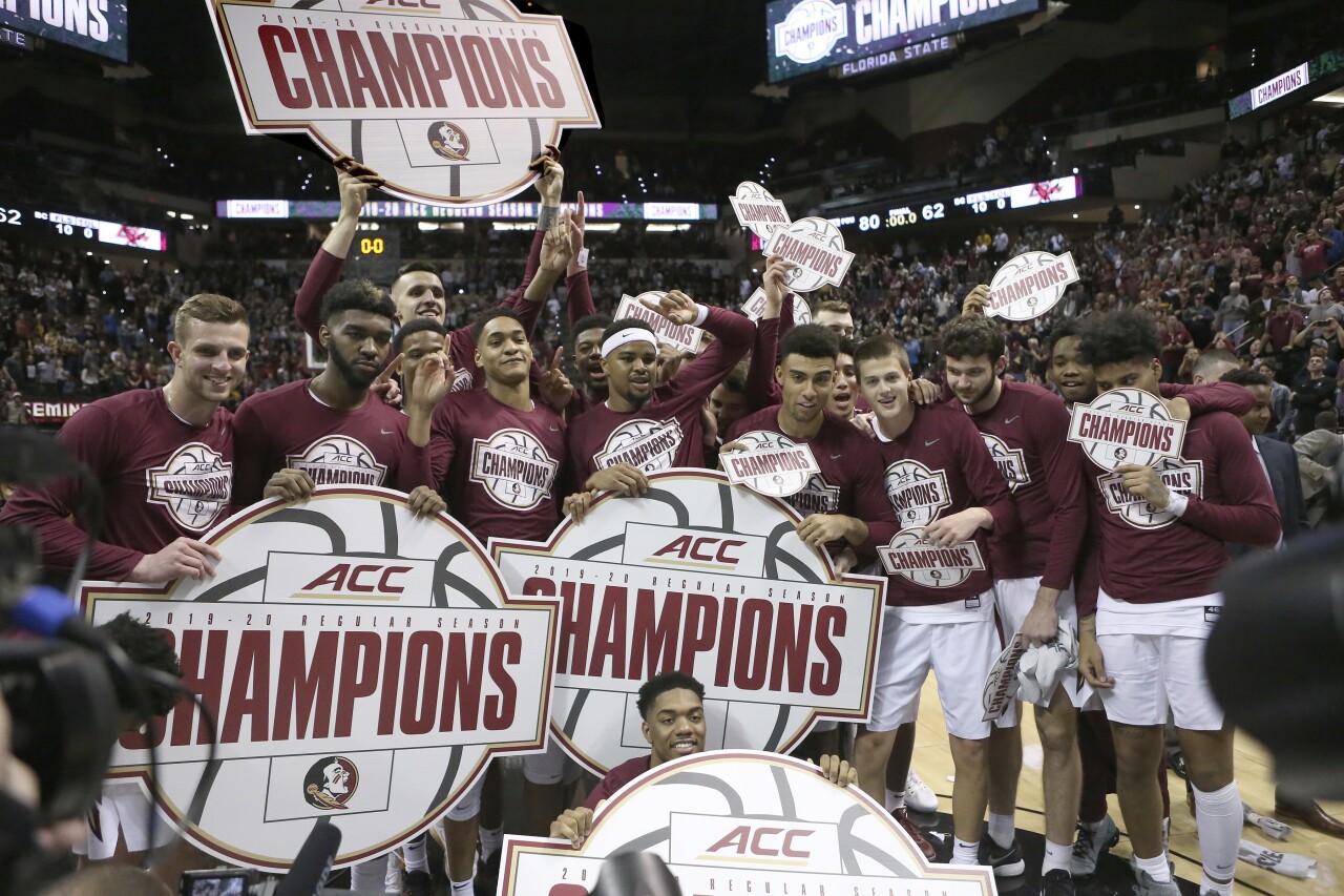 Florida State Seminoles celebrate ACC regular-season basketball championship after Boston College game in March 2020
