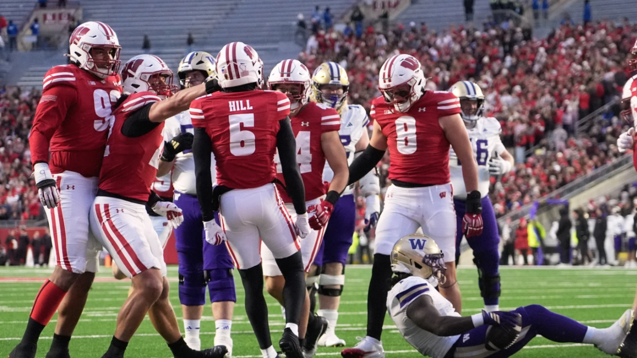Wisconsin's D'Yoni Hill celebrates after stopping Washington's Desmond Williams Jr. during the first half of an NCAA college football game Saturday, Nov. 8, 2025, in Madison. 