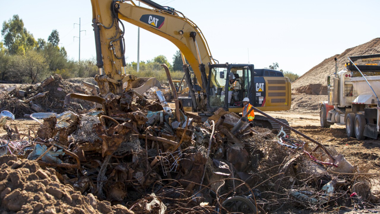Crews dig up "massive" amount of debris in Pantano Wash