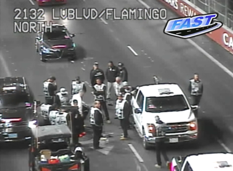 Formula 1 crews inspect drain hole covers across circuit