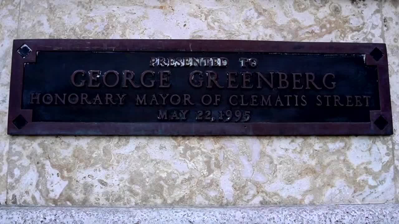 plaque recognizes contributions of George Greenberg, father of Pioneer Linens owner Penny Murphy