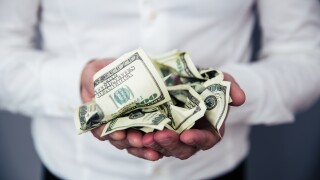 Business man hands holding money