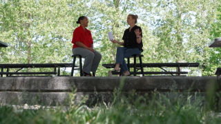 Omaha Performing Arts Marketing Director Dara Hogan, left, talks with 3 News Now's Mary Nelson at Miller Park.