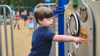 child plays on Brentwood inclusive playground
