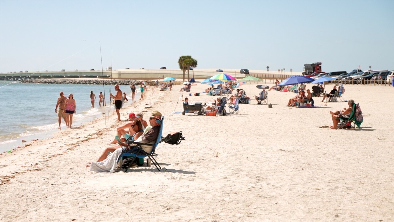 People enjoying the causeway beach