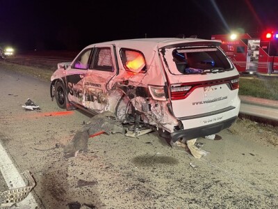 Weld County deputy suffers minor injuries after semi-truck runs into parked patrol vehicle