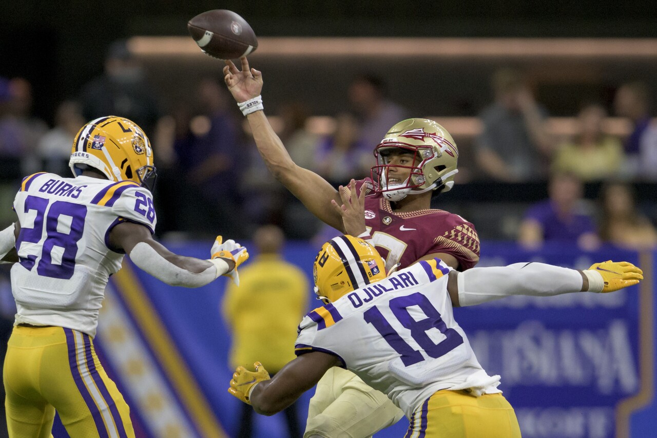 Florida State Seminoles QB Jordan Travis throws under pressure from LSU Tigers, Sept. 4, 2022
