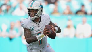 Miami Dolphins quarterback Tua Tagovailoa (1) aims a pass during the first half of an NFL football game against the New Orleans Saints Sunday, Nov. 30, 2025, in Miami Gardens, Fla. 