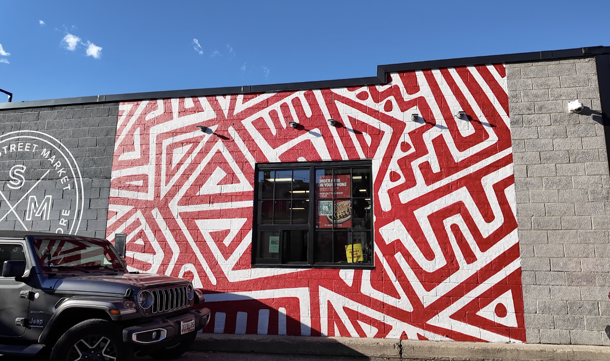 The Jollof Bowl pick-up window at Cross Street Market