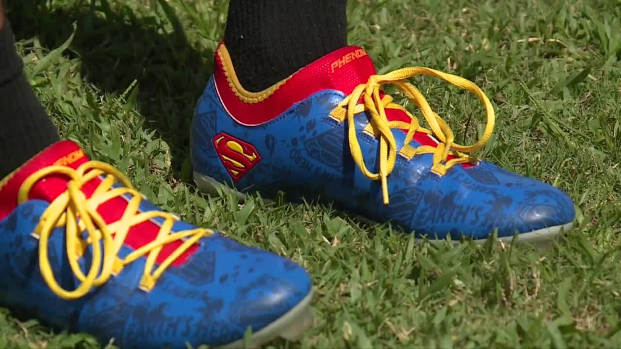 Steven Matos, a deaf football player at John I. Leonard High School, wears Superman football cleats at practice on Sept. 20, 2023.jpg