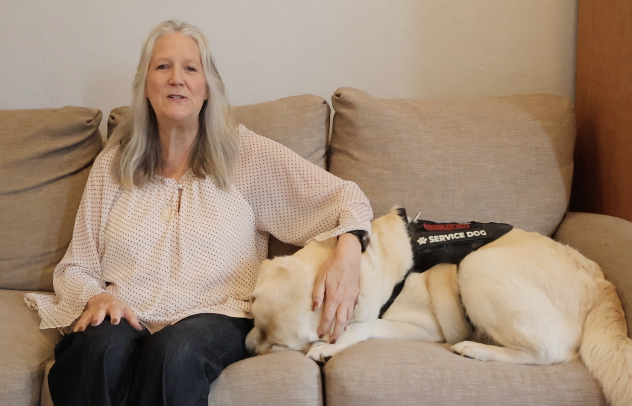Tracy Patterson is photographed with her service dog, Ned. She is a retired U.S. Air Force Combat Medic and rape survivor.